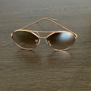 Prada sunglasses. Never worn. Comes with case and bag. SPR 56U